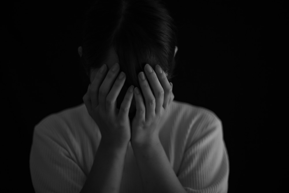 woman covering face